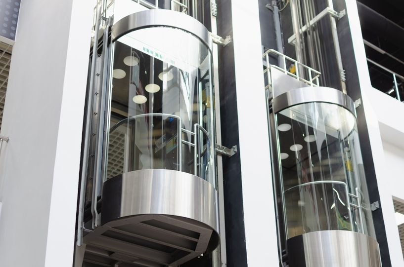 Two capsule-shaped elevators
